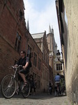 SX15576 Pushbikes and pedestrians in alley in Brugge.jpg